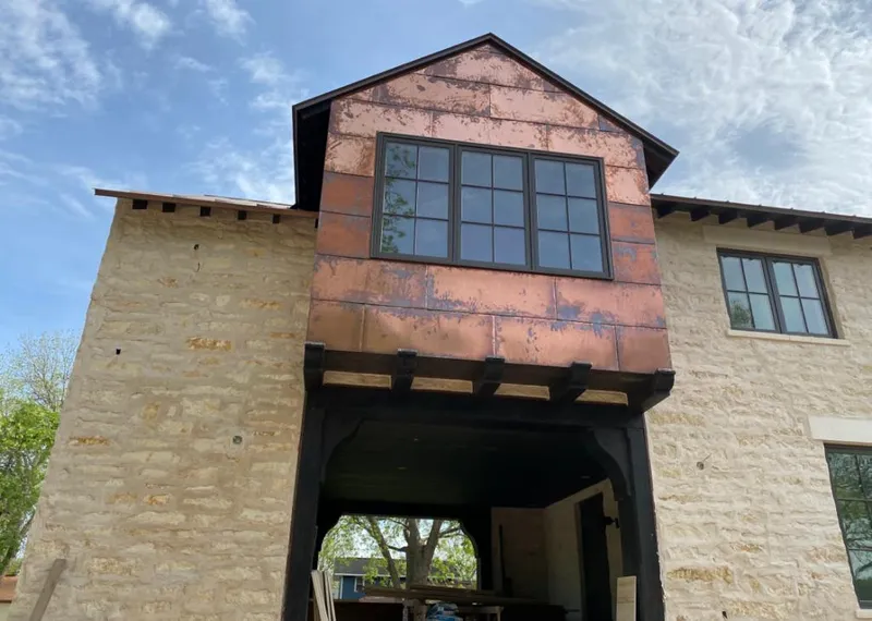 Copper metal panel facade on a stone building for Skylight Installation in Citrus Heights